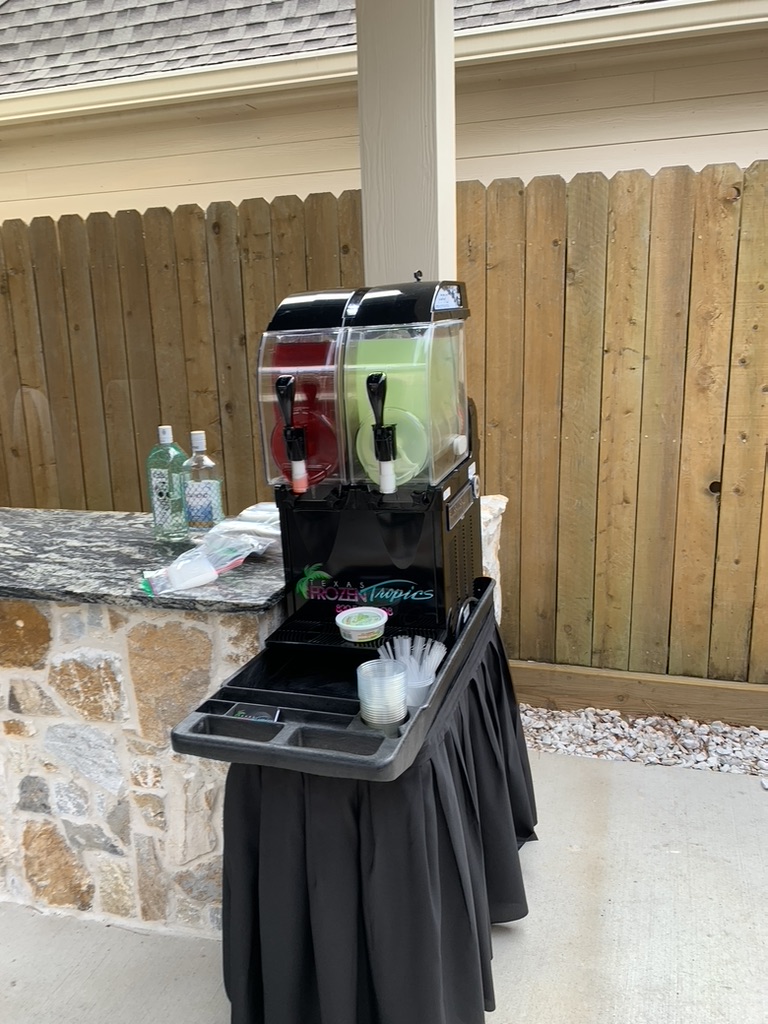 Texas Frozen Tropics machine set up on a patio bar for an early event