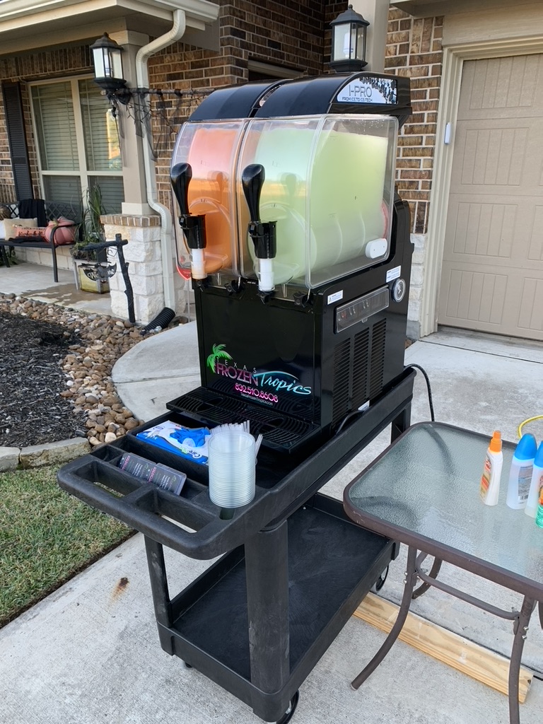 Texas Frozen Tropics machine set up on a porch for a fall rental