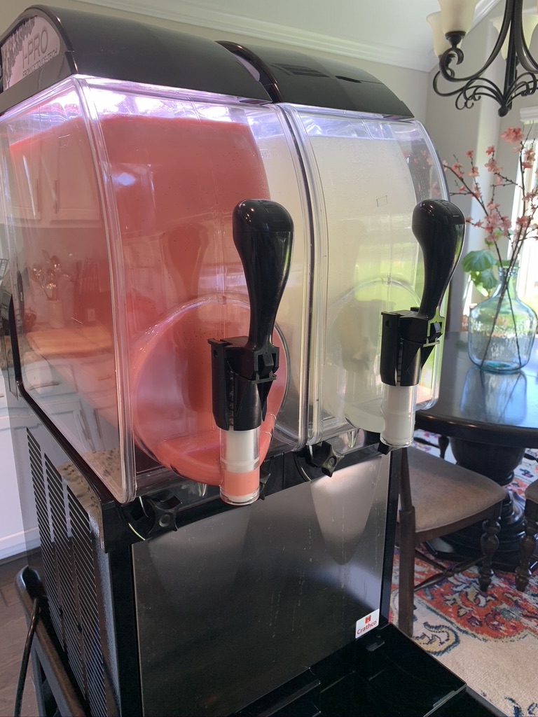 Texas Frozen Tropics frozen drink machine freshly filled with red and white flavors